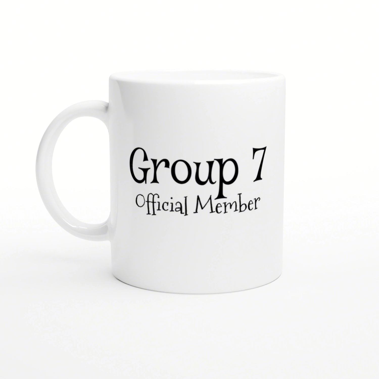 White ceramic mug displaying the text 'Group 7 Official Member' in decorative black font; product mockup.